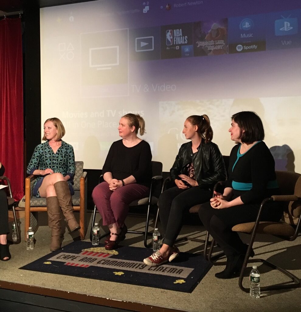 Photo of Hannah Bowen and four other speakers onstage at a Cape Ann Community Cinema event.